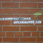 Stencilled grafitti reads: God Save Strawberry Jam