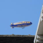 Photo of a Goodyear blimp above rooftop