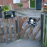 Two skull and crossbone warning signs: no menus or flyers!