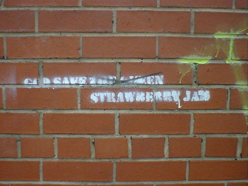 Stencilled grafitti reads: God Save Strawberry Jam