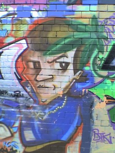 Graffiti art - a young man with a sharp haircut