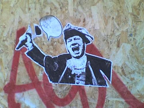 Wheatpaste sticker - a town crier, with an empty speech bubble.