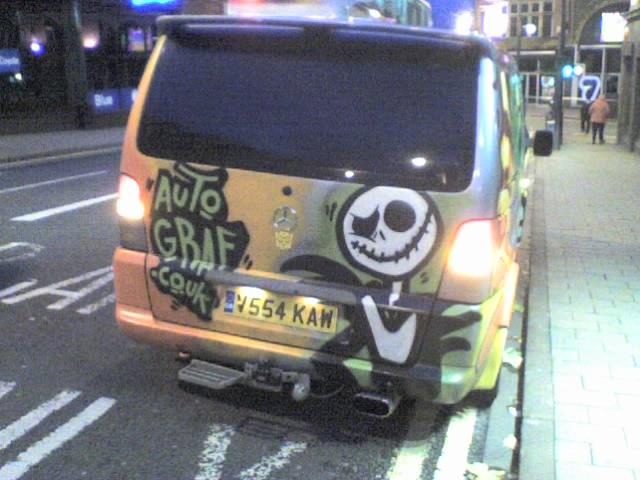 Van with custom graffiti-style paint job, depicts Jack Skellington