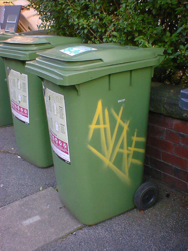 Yellow monogram on Green Bin
