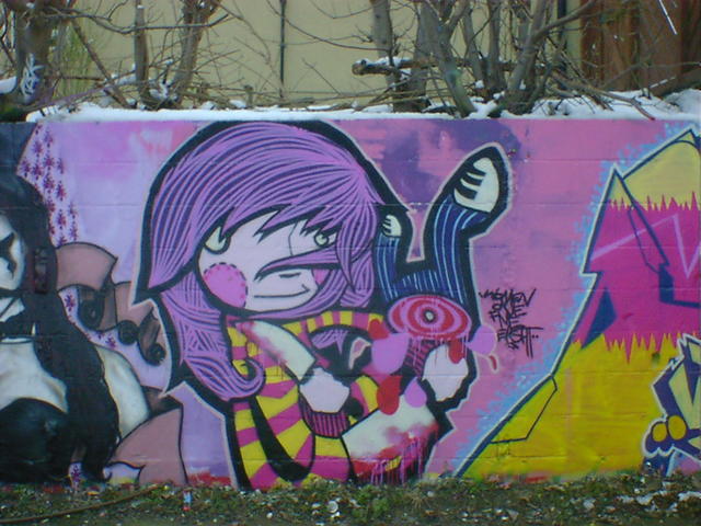 Cartoon girl graffiti with bloody cleaver, kitchen knife, and innocent smile