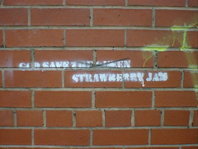 Stencilled grafitti reads: God Save Strawberry Jam