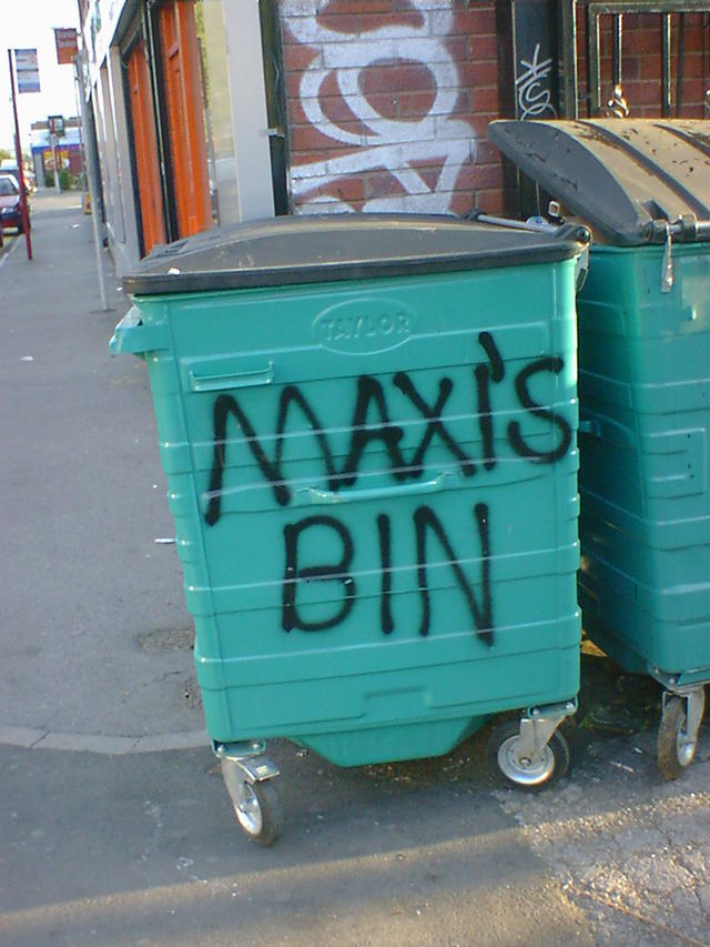 Maxi's bin Maxi's bin - spray painted on an industrial wheelie bin outside a takeaway shop.