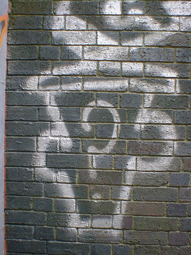 Mystery Man the outline of a head with question mark instead of a face.