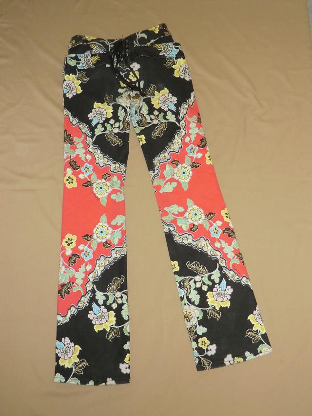 Red and black hipster jeans with a floral print.