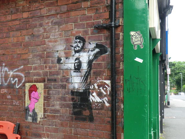 The Usual Suspects 3 pieces of art on a brick wall.
