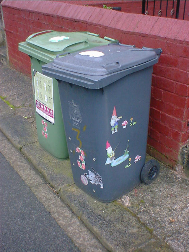 Gnome stickers decorating a wheelie bin