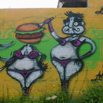 Fat woman in bikini with a hamburger for a head. A fat man sticks a fork in it.