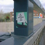A sticker on some railings, reads buy nothing all day.