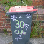 A wheelie bin with painted flowers and the word Chav, for Chestnut Avenue