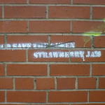 Stencilled grafitti reads: God Save Strawberry Jam