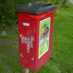 Make Stencils Not War, stencilled on the side of a dog-fouling bin