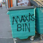 Maxi's bin - spray painted on an industrial wheelie bin outside a takeaway shop.