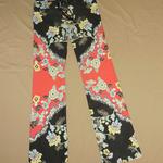 Red and black hipster jeans with a floral print.