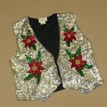 A sequined waistcoat, silver with red, green and gold flowers.