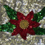 Flower design using red and green sequins, plus gold beads.