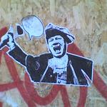 Wheatpaste sticker - a town crier, with an empty speech bubble.